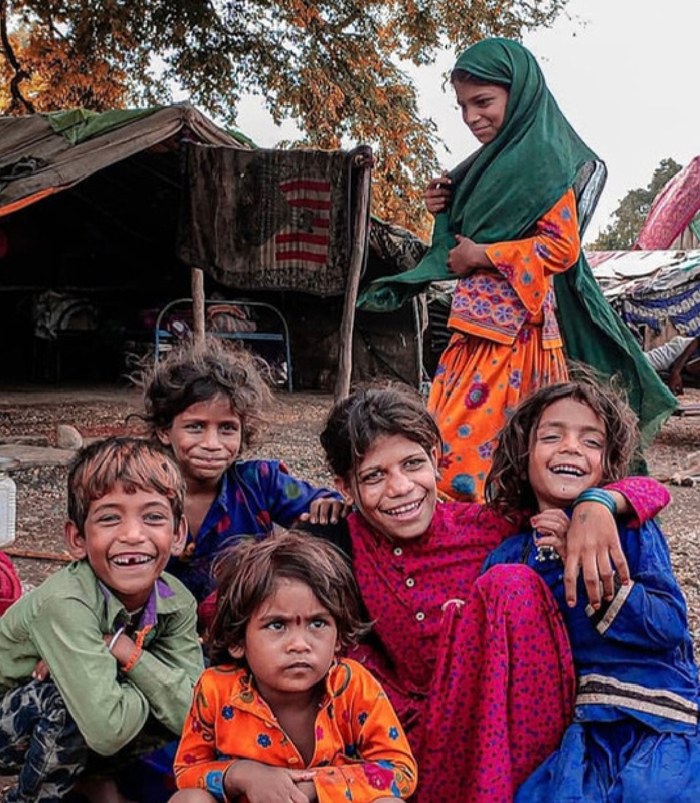 Group portrait of children in colorful traditional clothing, part of Pragati's personal photography