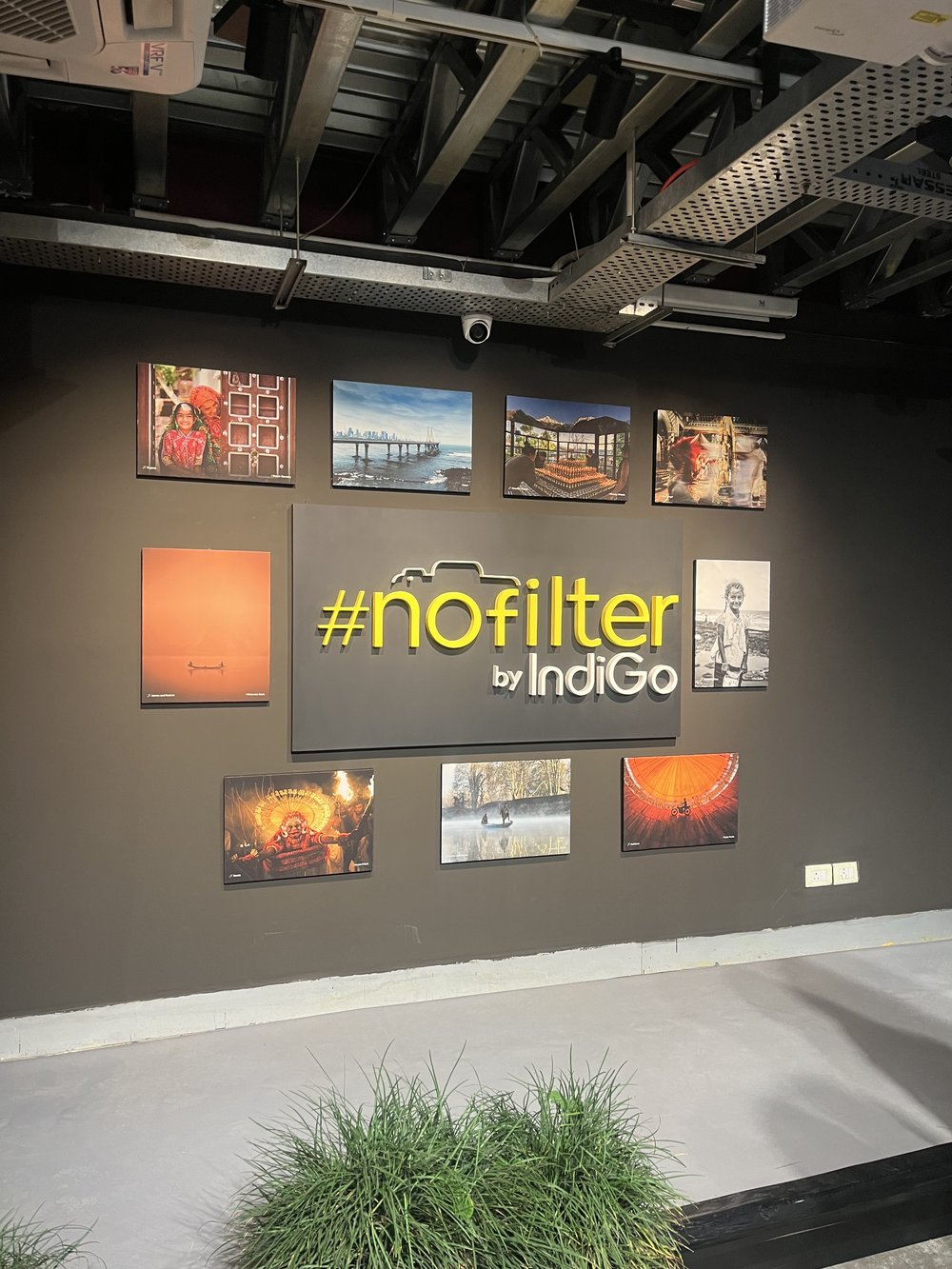The #nofilter by IndiGo exhibition wall showcasing community photography